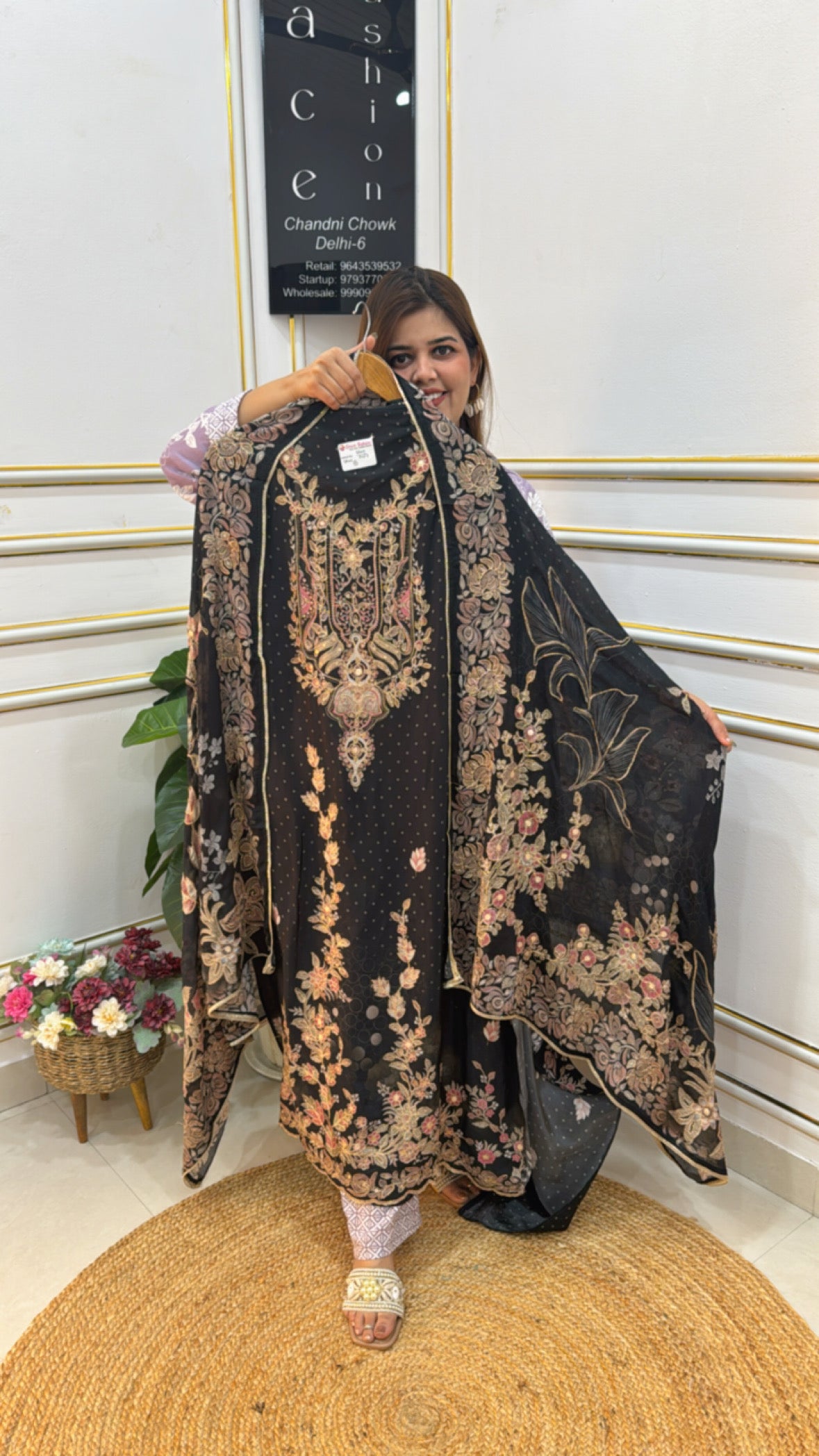 Elegant black floral embroidered outfit by The Grace Fashion with flowing cape design